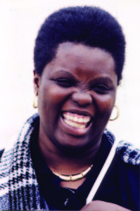 Close up of Lois Curtis (L.C. in the Supreme Court Olmstead decision) smiling joyfully.